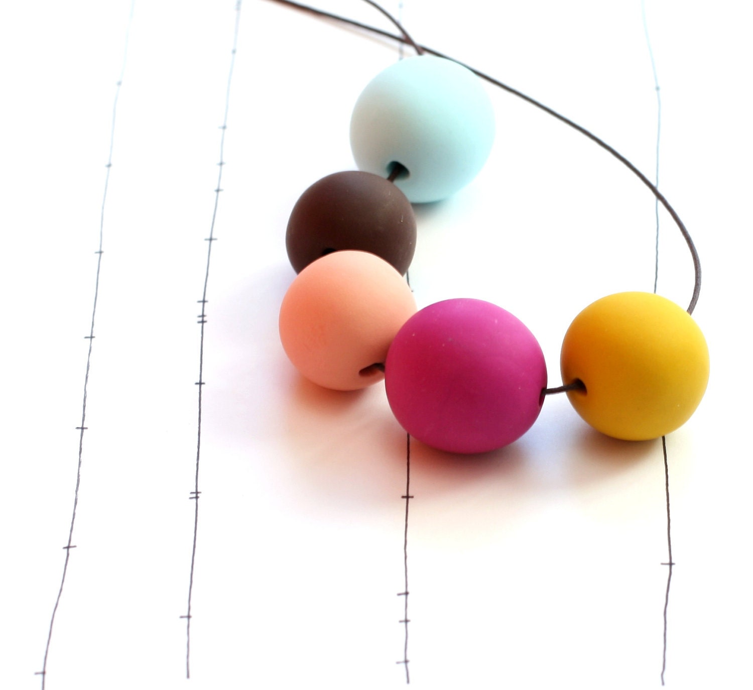 not quite round handmade beads make a necklace