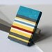 Ring with red, grey, turquoise, white, yellow and blue stripes, geometric statement ring