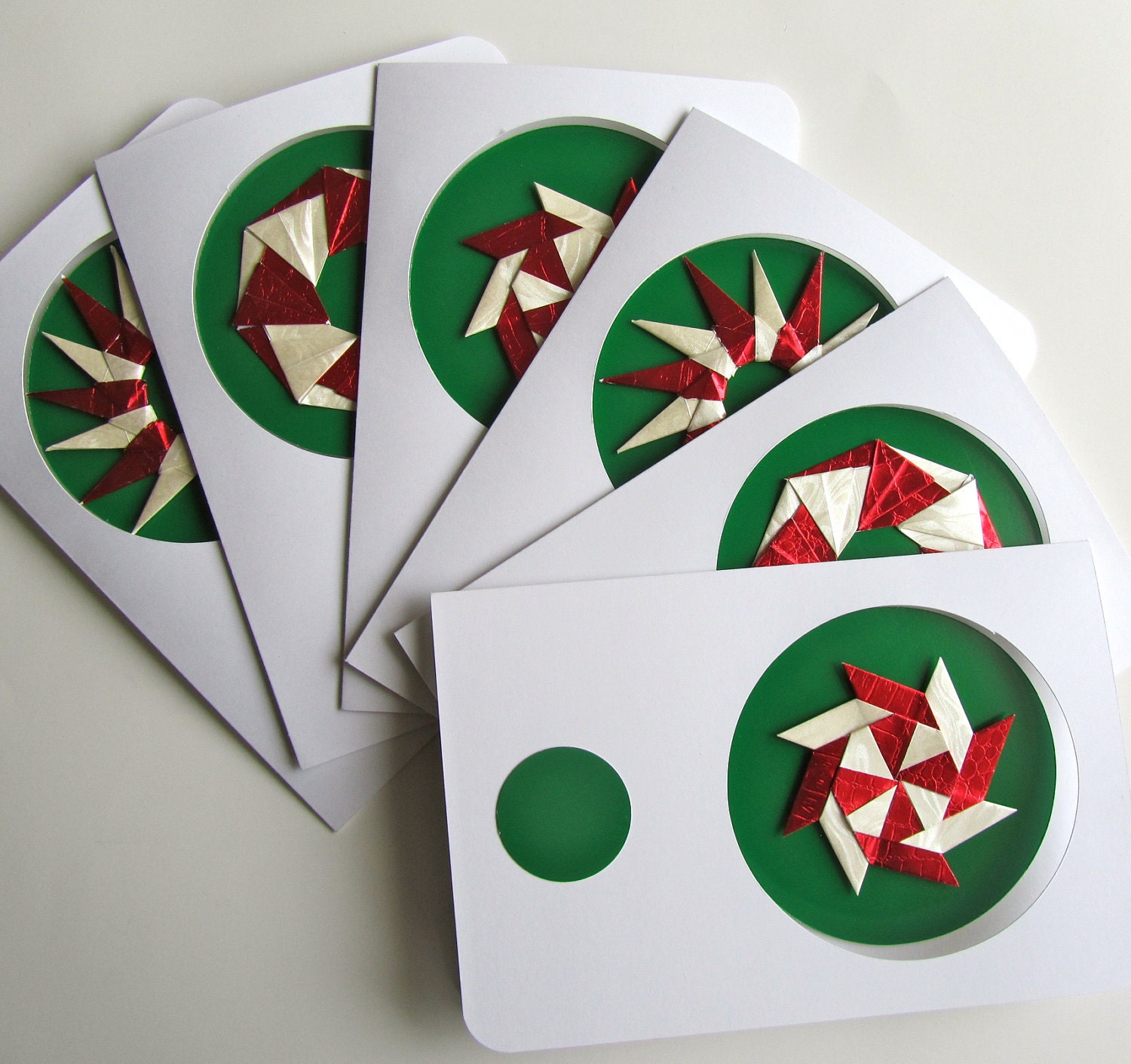 Christmas Greeting Cards Contain DETACHABLE TREE ORNAMENTS, Handmade as Stars/ Wreaths in Shimmery Red and White on Green. One Of A Kind.