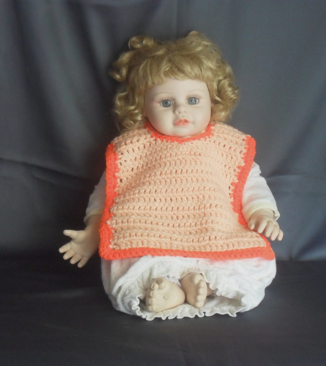 Crochet Baby Bib.  Peach with Orange Trim and Black Button. Adorable shower gift.