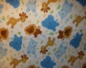 Adorable brown, blue and gold colored animal & alphabet print  fleece baby blanket