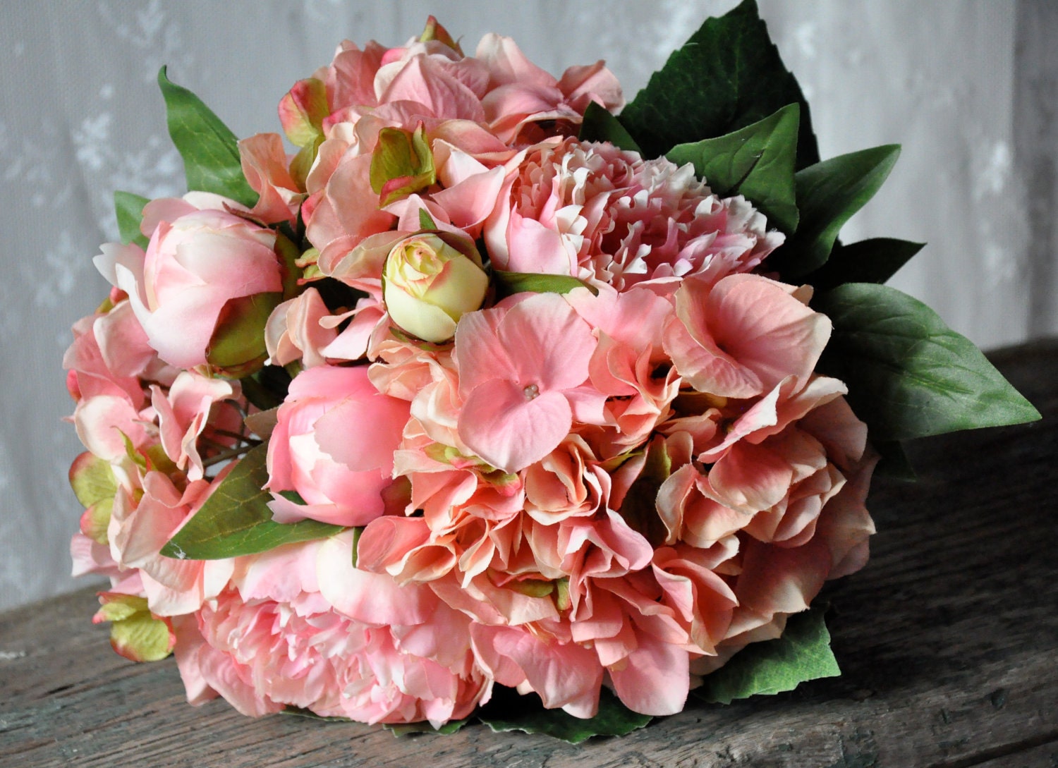 Pink peony and hydrangea wedding bouquet.