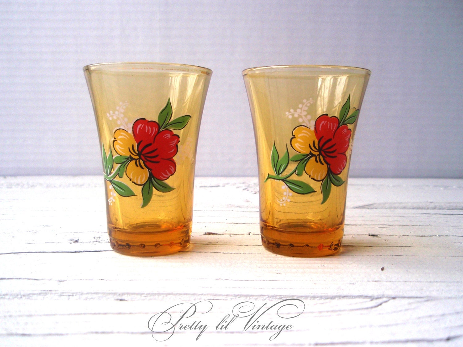 Vintage amber shot glasses with floral print