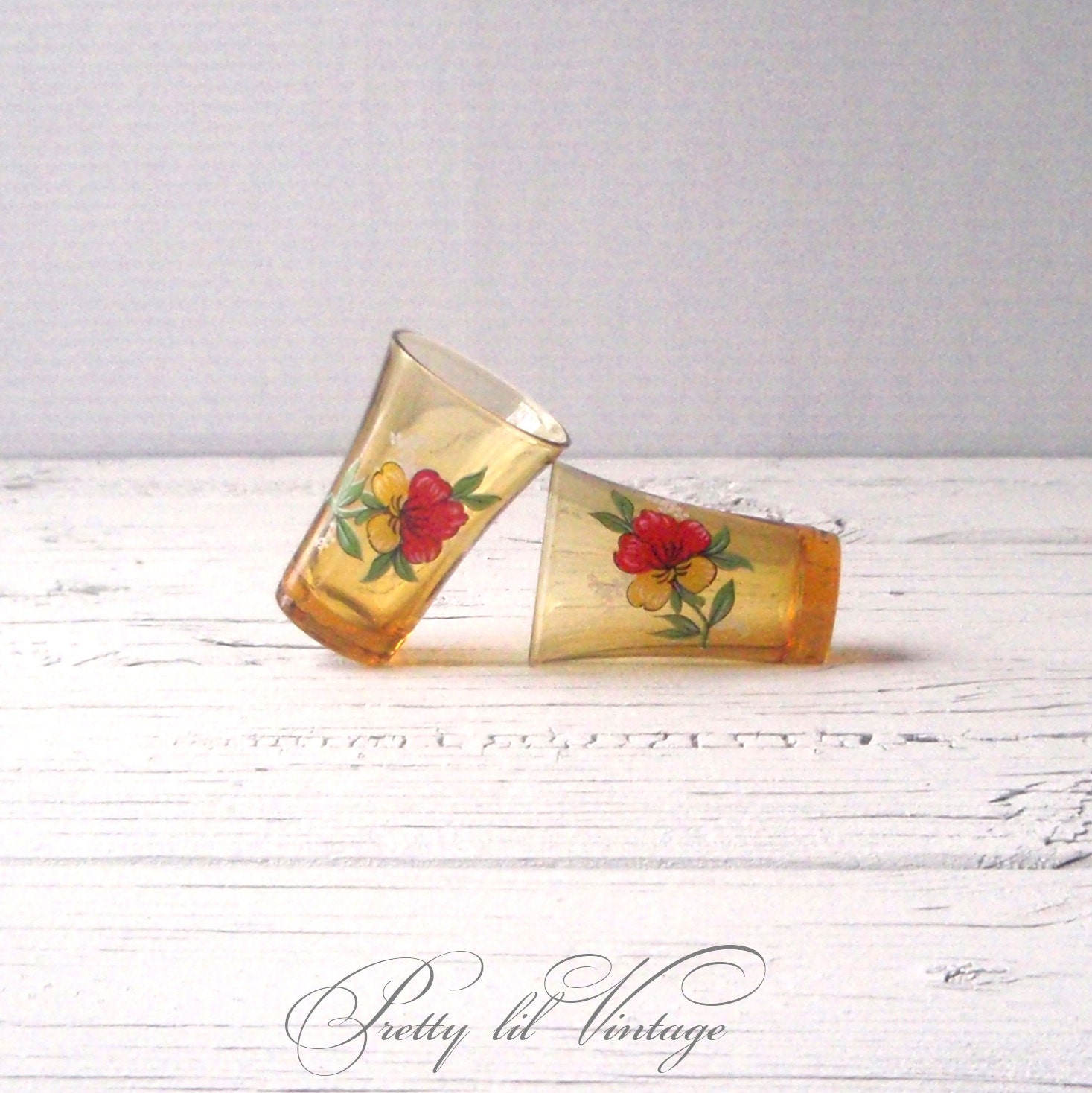 Vintage amber shot glasses with floral print