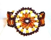 Beadwoven Glass Bracelet In Shades Of Copper Topaz And Yellow