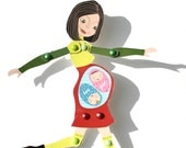 Articulated pregnant paperdoll with green and red dress. It's a girl and a boy.
