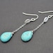 Turquoise teardrop and matte finished leaf silver earrings.