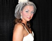 Bridal tulle veil with rhinestone edging and rose fascinator of champagne ivory