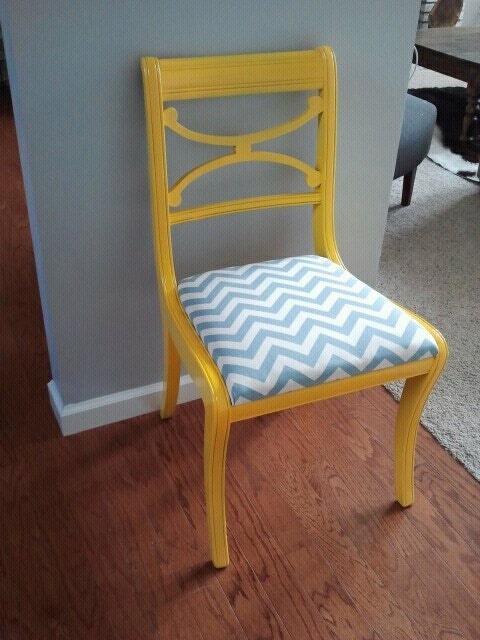 yellow gloss chair with blue and white chevron seat.