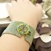 Green Cuff Bracelet Beaded with Flower Motif Button Metallic Iridescent Sparkle Handmade by JeannieRichard