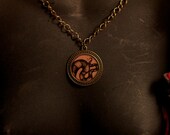Striking Striped Curl Necklace in Tentacle-Polished Golden Brass