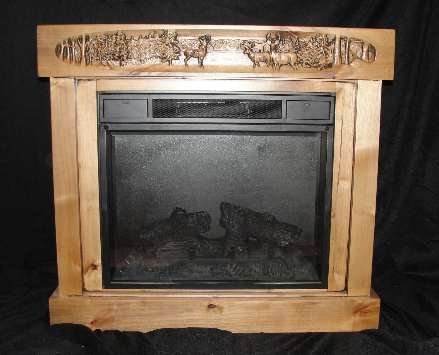Electric fireplace with Knotty Alder surround and Carved Mantel
