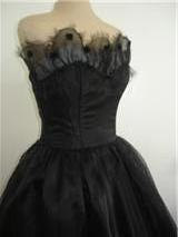 A Unique 50s style cocktail dress in black duchess satin with  hand crafted neckline trim size 10