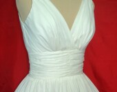 The perfect simple but elegant 50s style dress. made from cotton Muslin fit for any occasion. Any size welcome.