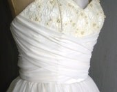 A beautifully elegant off-white 50s inspired wedding dress
