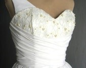 A beautifully elegant off-white 50s inspired wedding dress