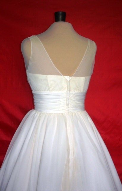 A beautifully elegant off-white 50s inspired wedding dress