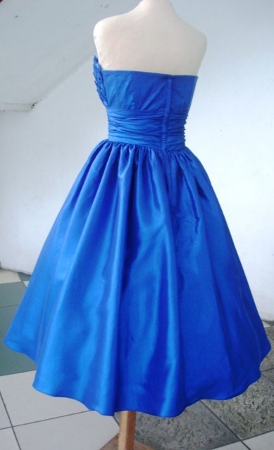 Alluring intricate, 50s inspired ball dress with beautiful bust detail inspired by blooming petals