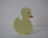 Small yellow wooden ducks
