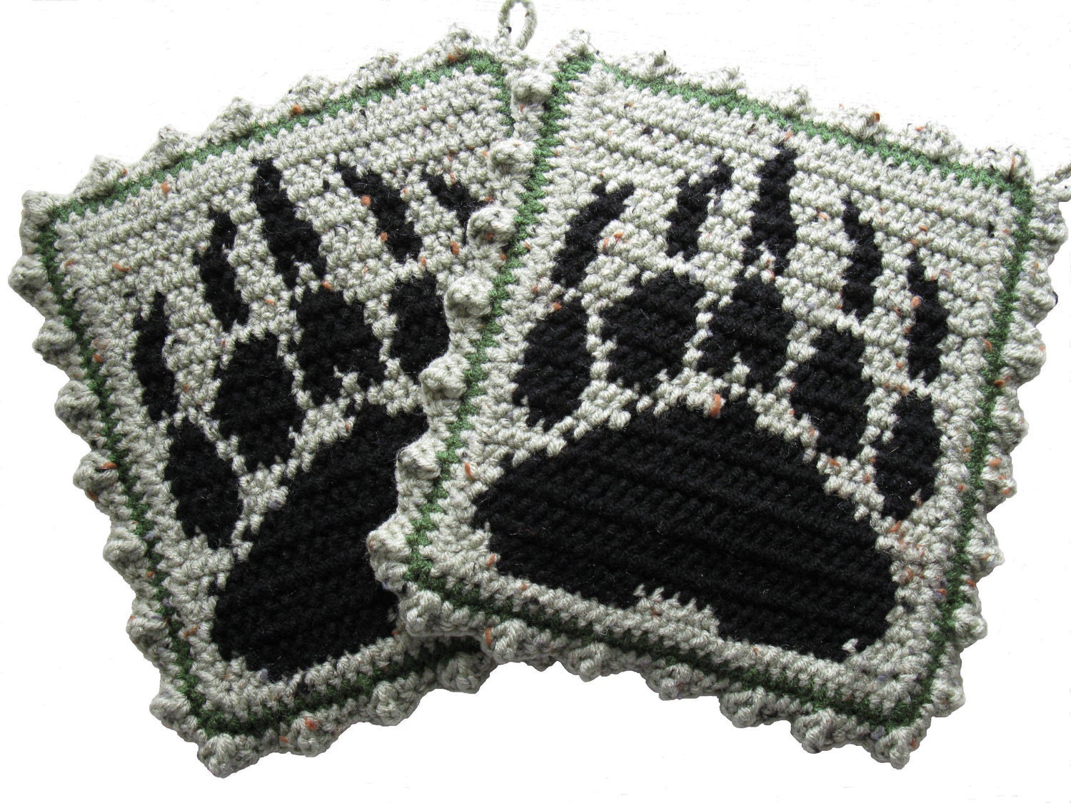 Bear Claw Potholder set.   Grizzly bear paw print on a speckled green background