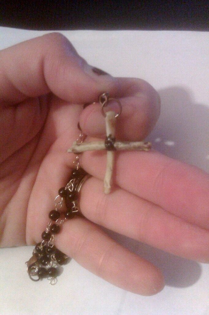 Rosary style bracelet with bone cross