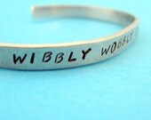 Doctor Who Inspired Bracelet - Wibbly Wobbly Timey Wimey - Hand Stamped Aluminum Cuff - customizable