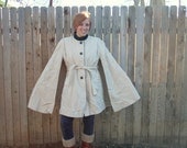 60s 1960s cream wool cape swing coat by Country Pacer. Brown velvet trim. Tie sash. Boho mod style. Size large 8-10-12