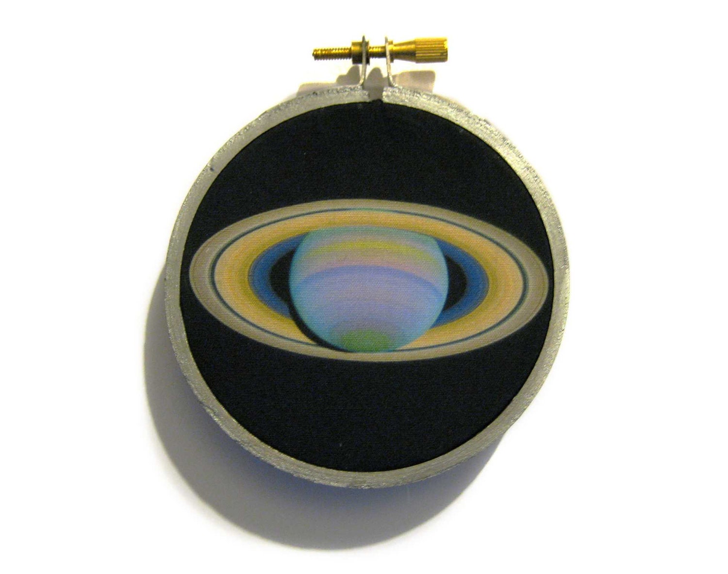 NASA captured planet Saturn image in silver embroidery hoop