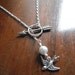 The Hunger Games - Sterling Silver Katniss Mockingjay Pin Archery Necklace with Peeta's Pearl - Lariat