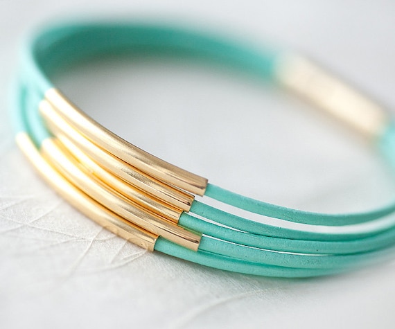 Resreved for Monica T: Mint Green Leather Bracelet with 6 Golden tubes by pardes israel