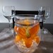 Hurricane Vase Floating Candle Centerpiece with Artificial Orange Lily and Amber LED Light