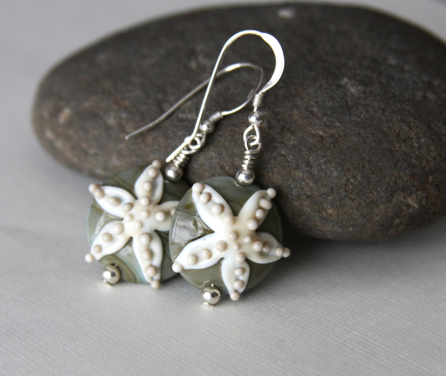 Earrings made with lampwork glass beads with a starfish design