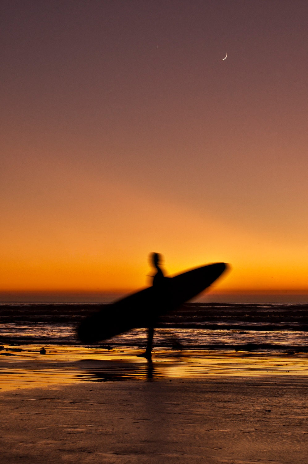 Surfers In Sunset