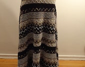 long, woven, wool skirt. Black and gray striped horizontally