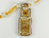 Polymer Clay Pendant with Real Flower and Leaves sealed in Resin