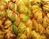 Golden silk sari ribbon or yarn.  Sixty yard skein.