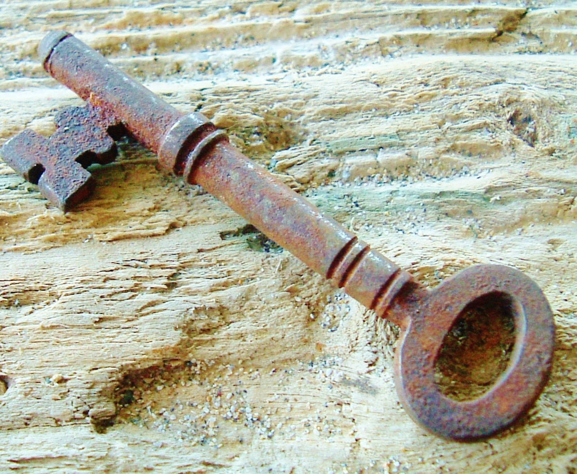 Little antique skeleton key in aged iron for an English cottage door