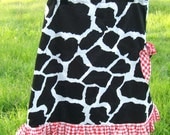 Girls skirt size 6, cowgirl  skirt, black and white cow spot skirt with red gingham ruffle and slouchy button pocket.