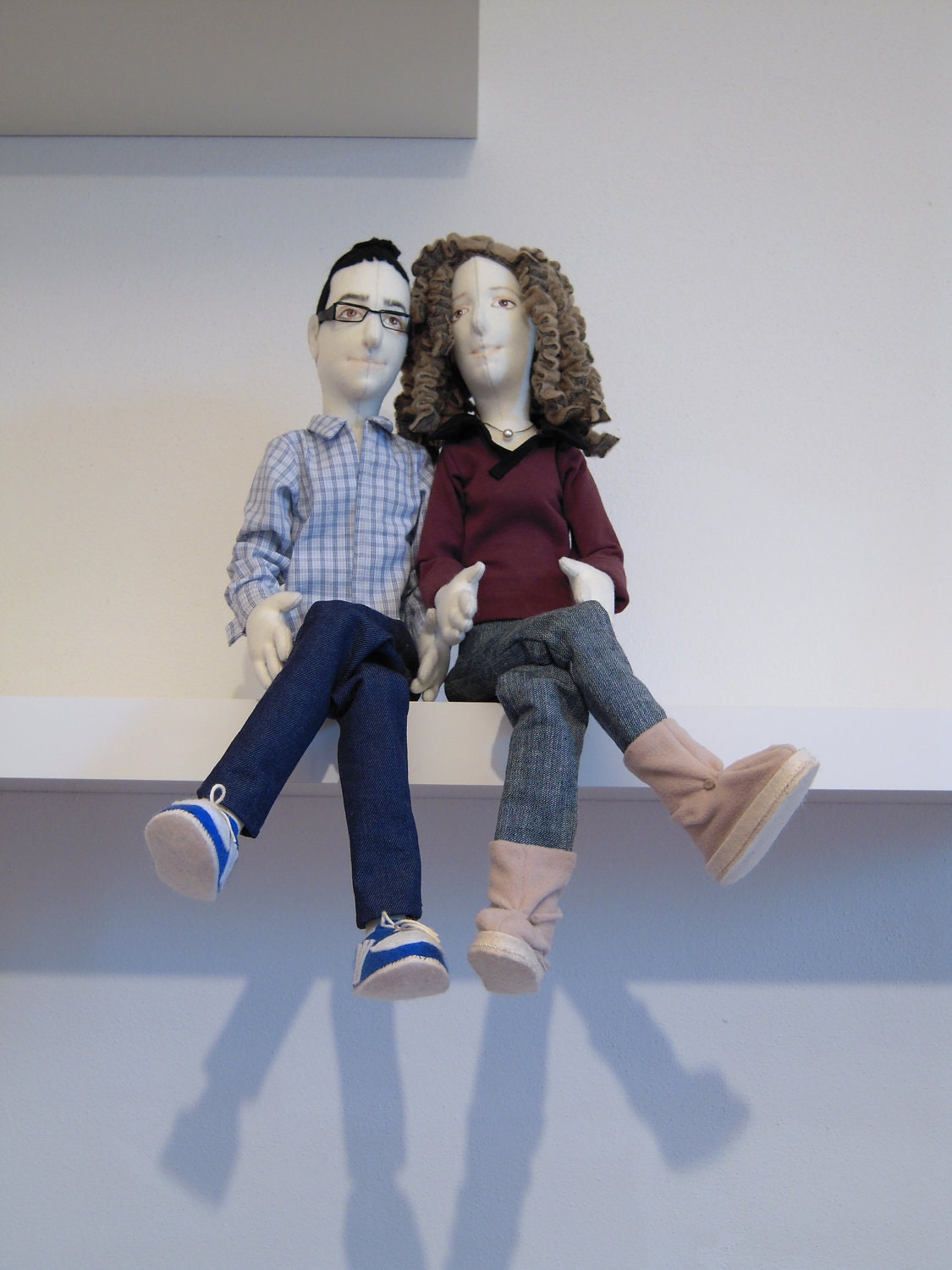 A couple of portrait dolls in cloth.