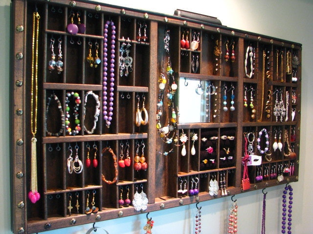 Mirrored printer drawer jewelry dispaly with side stud slots to allow for maximum storage as well as 2 ring cubbys
