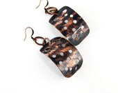 Metal copper earrings with original finishing.  Long, dangle light weighted with holes by BrandFaina.