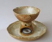 Cookie and hot chocolate pot with candlestick.