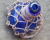 Beach Decor Cobalt Blue Glass Pirates Rum Jug in Rope Netting by SEASTYLE