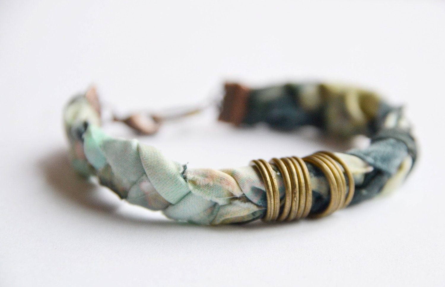 Fabric bracelet. Pastel fabric hand braided with antique copper metal rings.Mint, rose, blue and green colors. Medium size