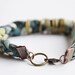 Fabric bracelet. Pastel fabric hand braided with antique copper metal rings.Mint, rose, blue and green colors. Medium size