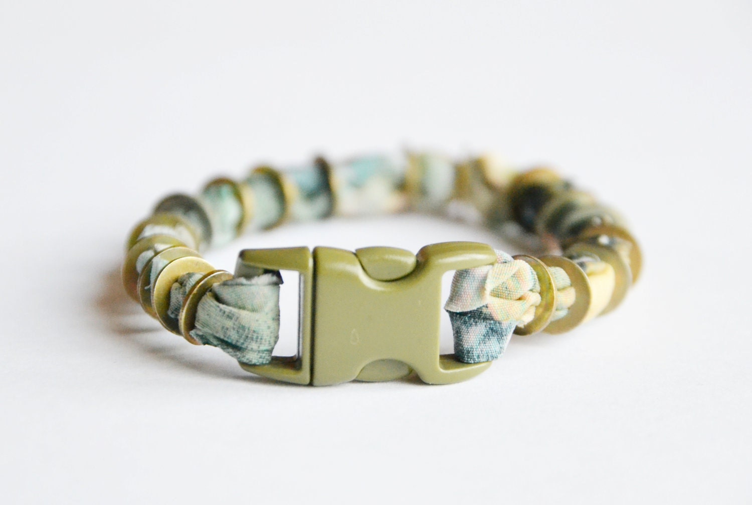 SALE. Fabric and metal cuff. Pastel fabric with vintage nuts and bolts and snap buckle closure. Small size. 25% OFF.