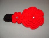 Black, handmade, crocheted child/baby headband with red flowers