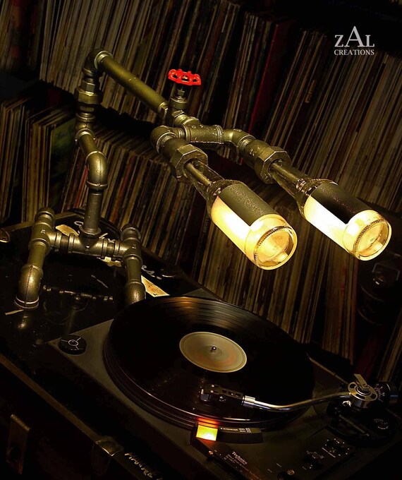 Desk lamp. Beer bottles. Plumbing pipe & fittings. Table lamp.