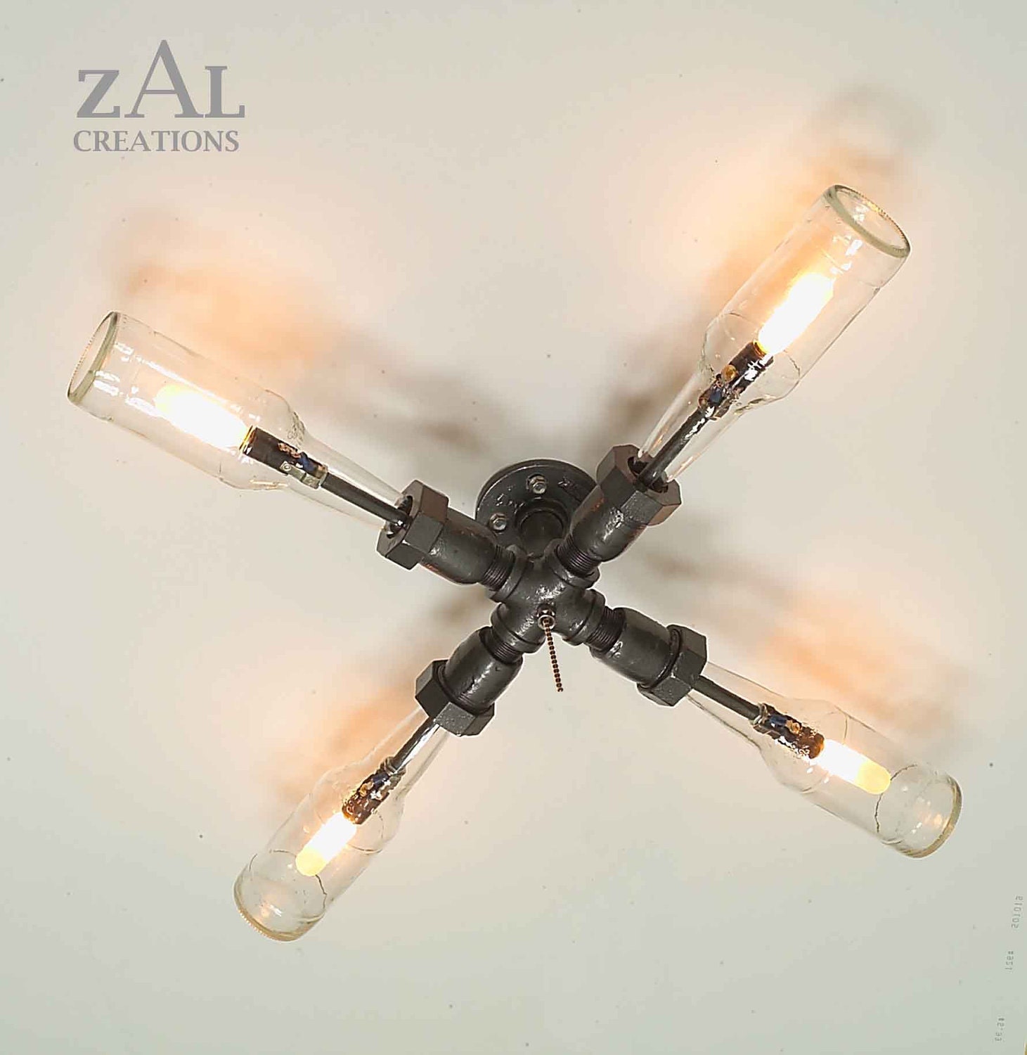 Wall Lamp. Beer bottles,  Plumbing pipe & fittings. Wall light.  Lighting Fixture. Ceiling lamp