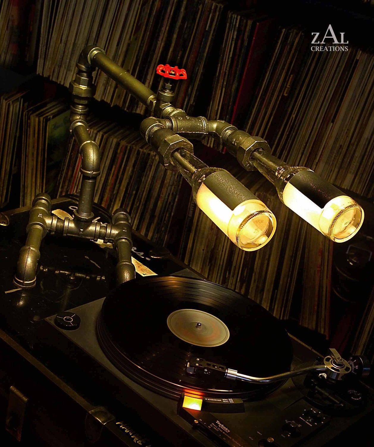 Desk lamp. Beer bottles. Plumbing pipe & fittings. Table lamp.